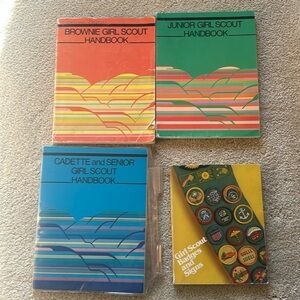 Girl Scout handbooks, badges, and signs 4 books